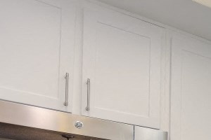 Renovated kitchen with white cabinets, countertops and stainless steel appliances Renovated kitchen with white cabinets, countertops and stainless steel appliances - Photo Gallery 5