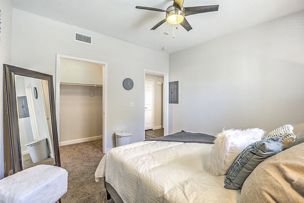 Discover comfort and style at The Michael B: plush carpet, walk-in closets, and ceiling fans for a cozy retreat.at The Michael B Townhomes and Flats, Las Vegas