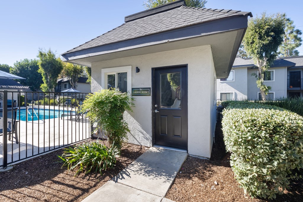 the front door of a house with a swimming pool