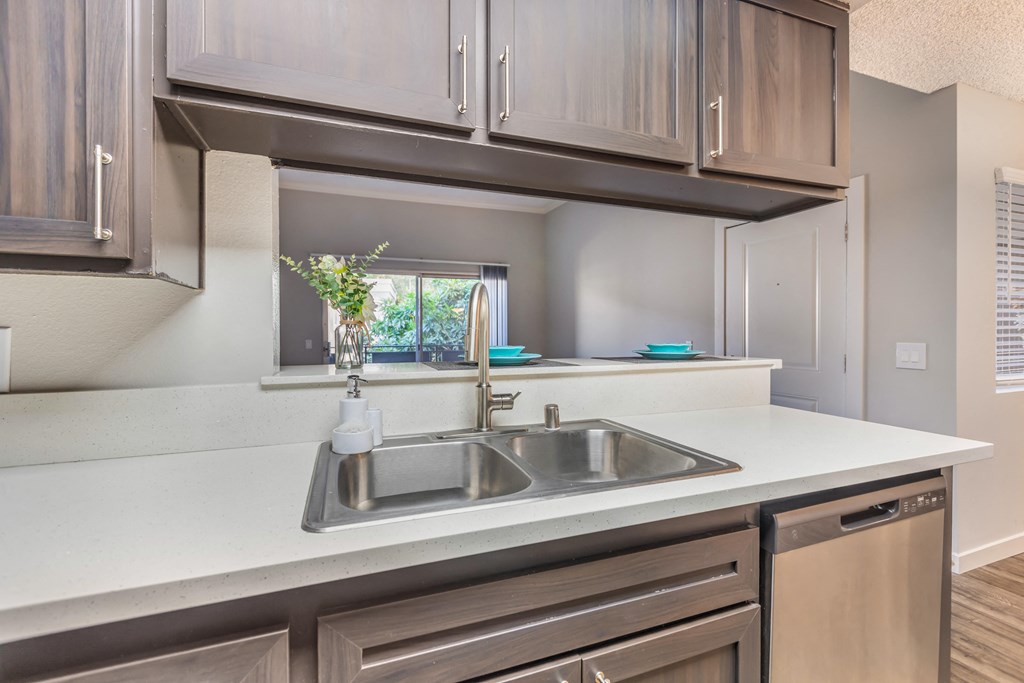 a kitchen with a sink and a window