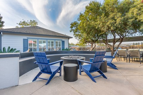 Our complex offers lounge chairs surrounding our pool deck's fire place