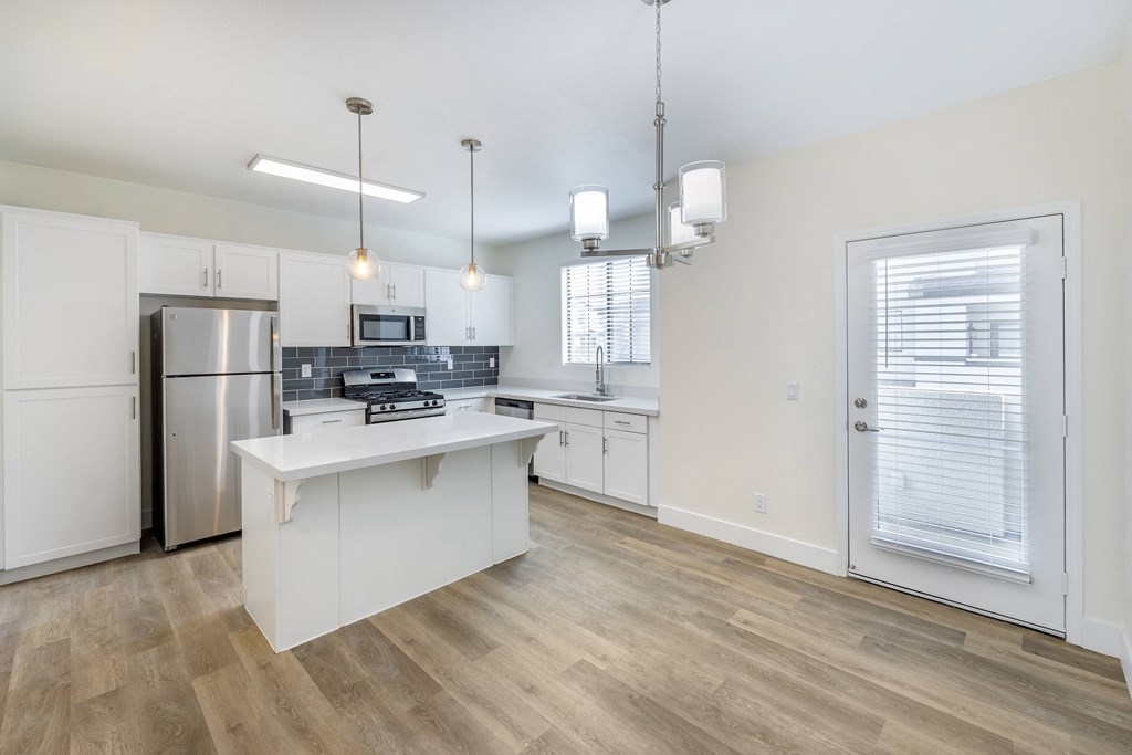 Each unit features a fully updated kitchen with sleek, contemporary amenities, including stainless steel appliances, new cabinetry, and elegant countertops.