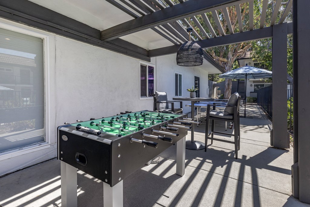 Covered area with foosball and sitting area.at Sage Creek Apartment Homes, Simi Valley, CA 