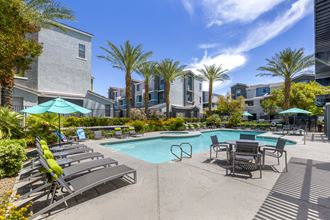 Swimming pool with lounge chairs and umbrellas