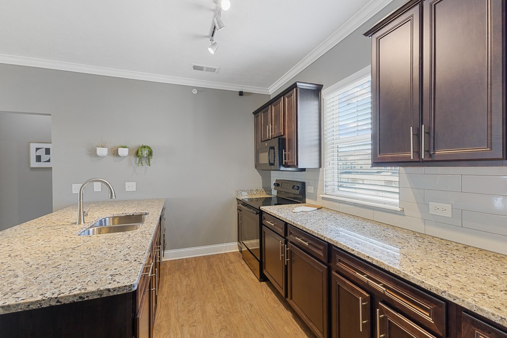 Large Kitchen With Granite Counters and Subway Tile BackSpash