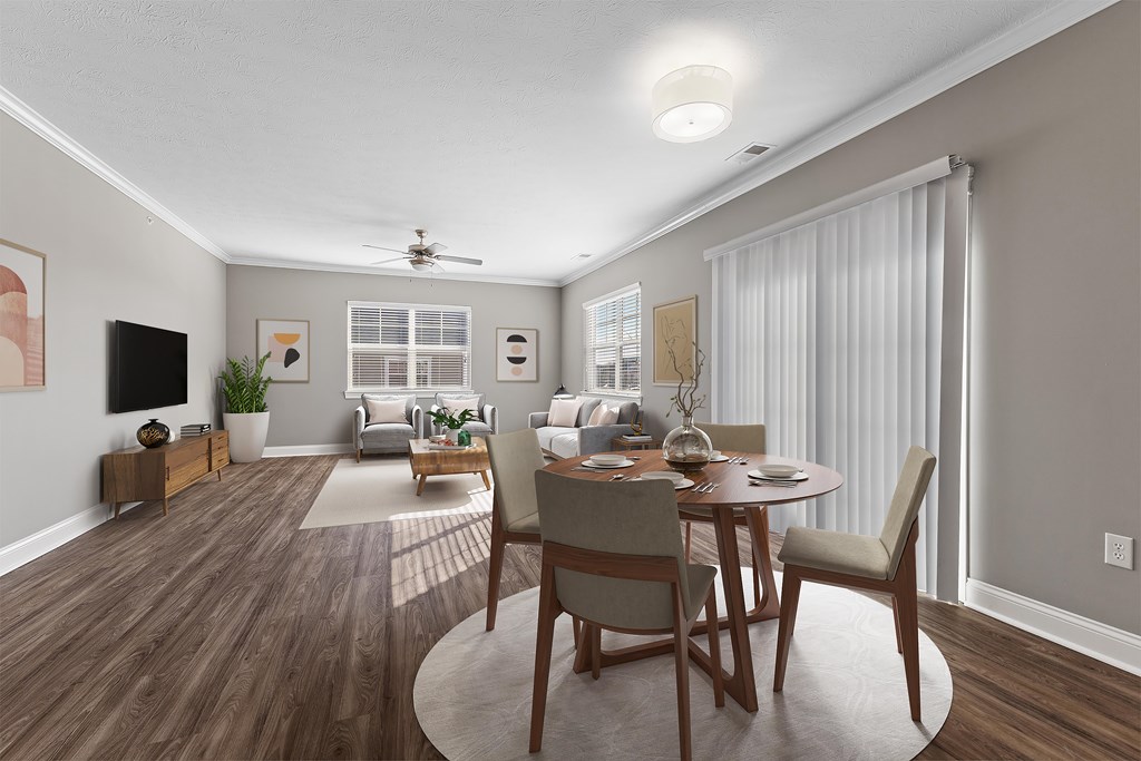 3Bedroom Open Concept A modern dining room with a wooden table and chairs.