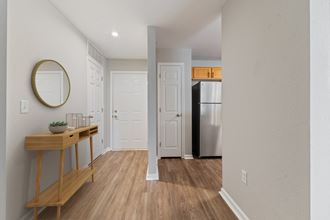 Private Entrance from a Shared hallway Enterance to an apartment with walk way into the kitchen and living room - Photo Gallery