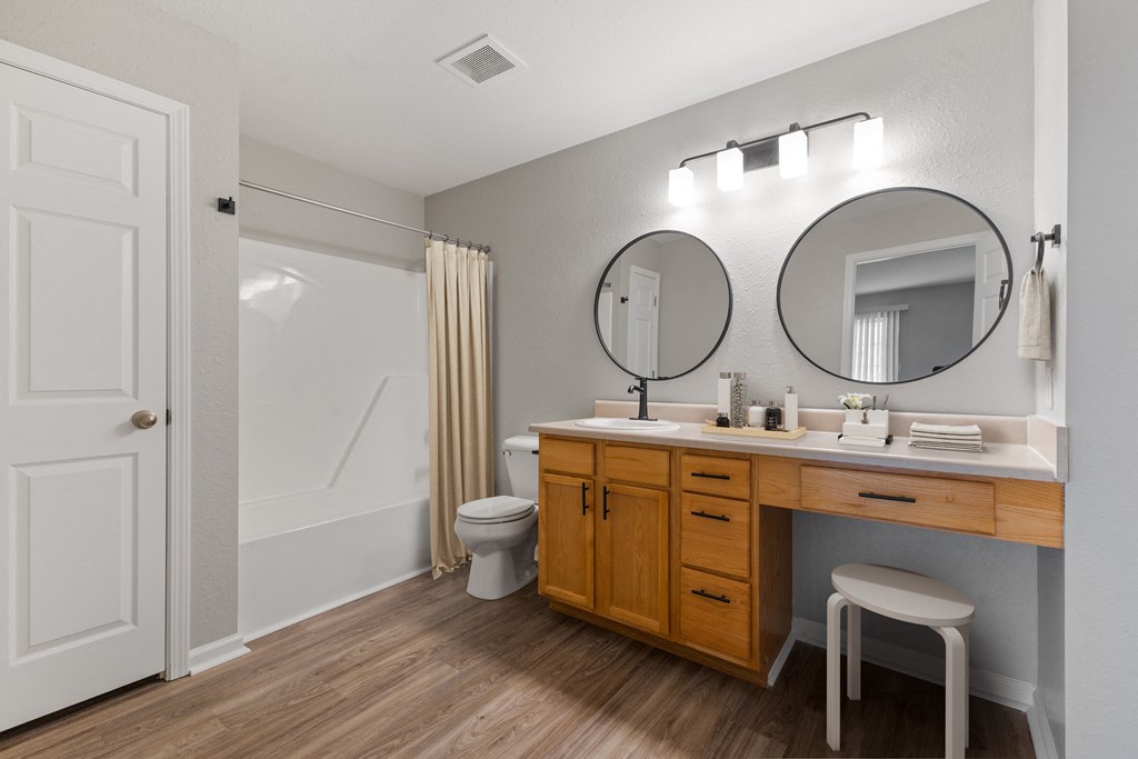 Primary bathroom with updated fixtures and mirros