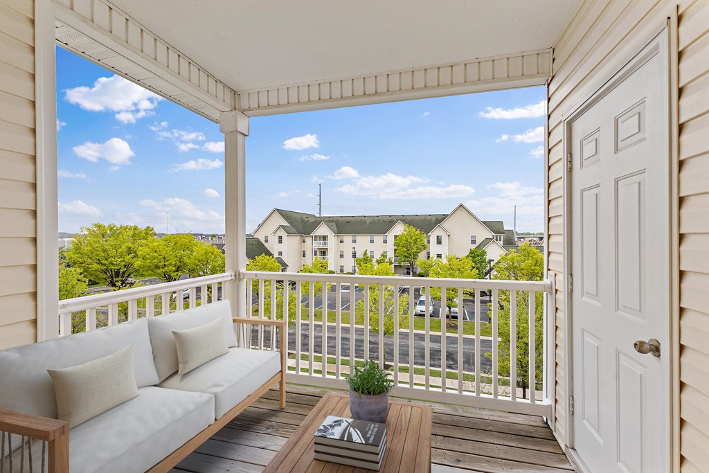 Large Balcony that has storage closet and overlooks property