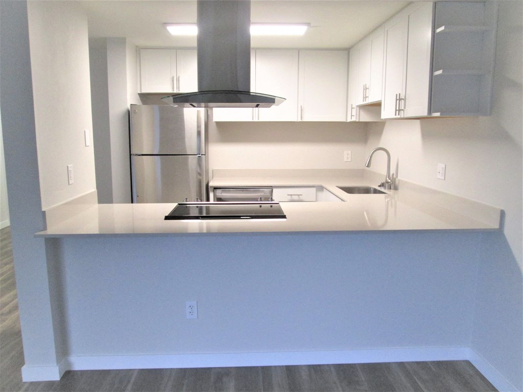 Cedar One Bedroom Kitchen With Stainless Range Hood at Cedar Heights, Kirkland, WA
