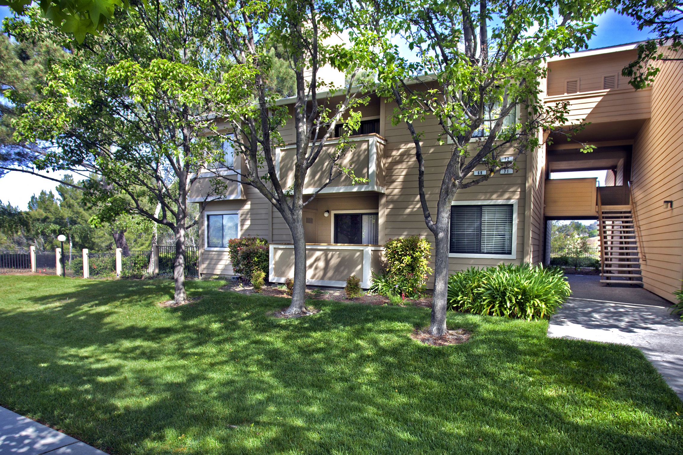 Tree-lined grass area in front of apartments at Club Pacifica, Benicia, CA 94510