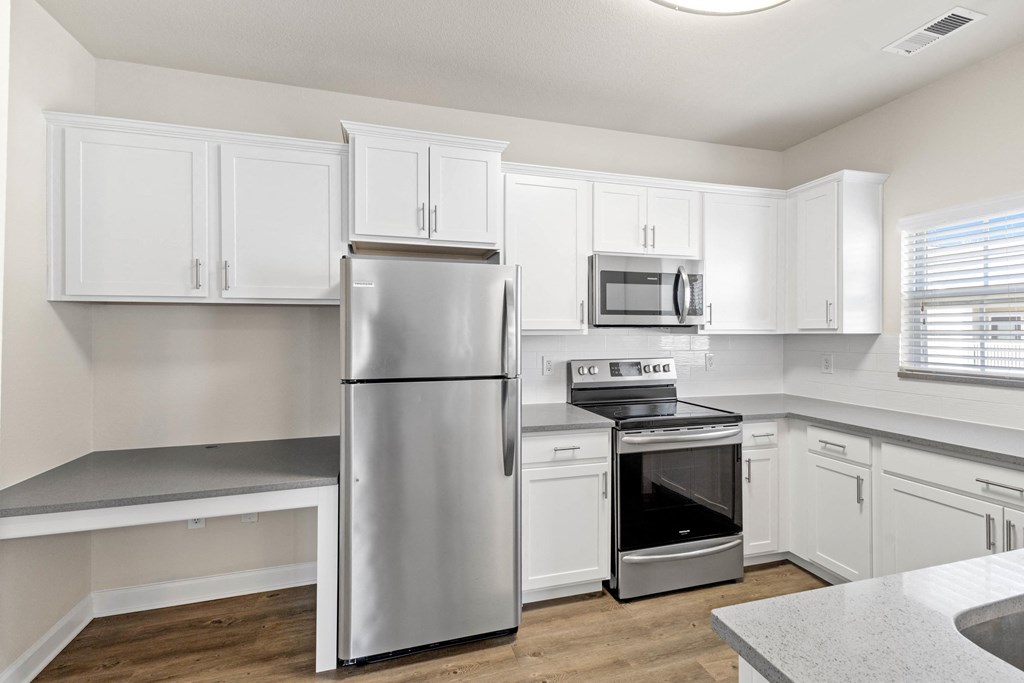 Stainless Steel Appliances and updated fixtures in kitchen