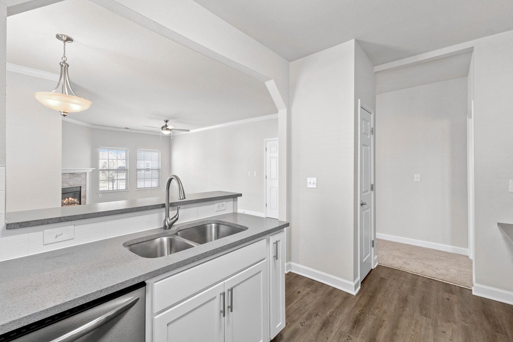 Breakfast bar looking into living room with extra counterspace