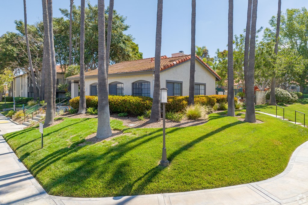 a house with tall palm trees in front of it at La Serena, San Diego, CA 92128