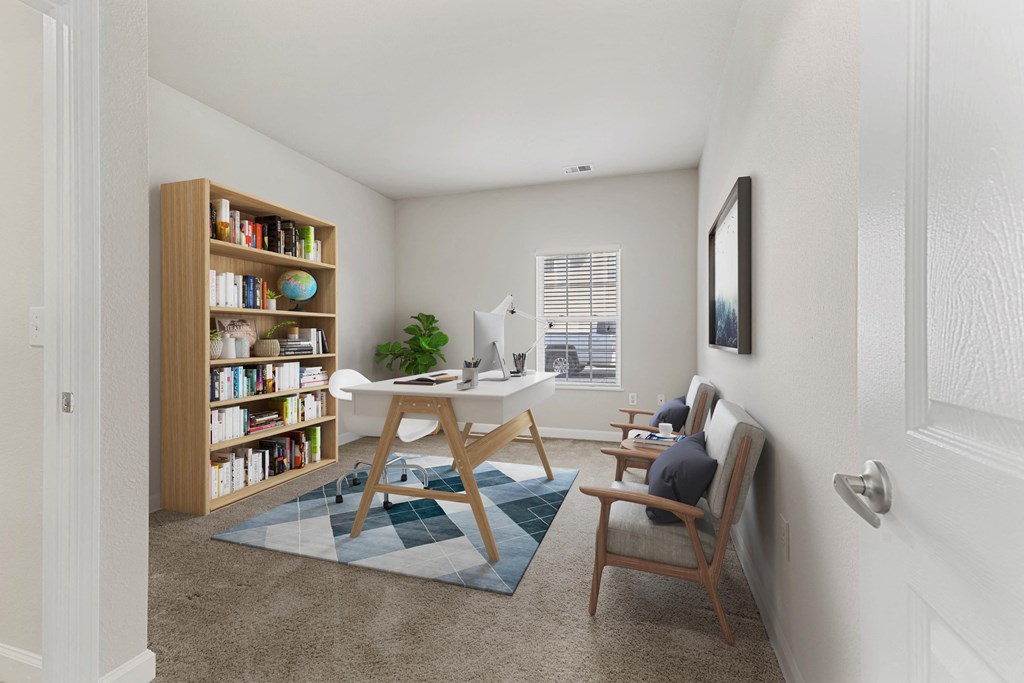 Guest room with space for an office with a desk and computer