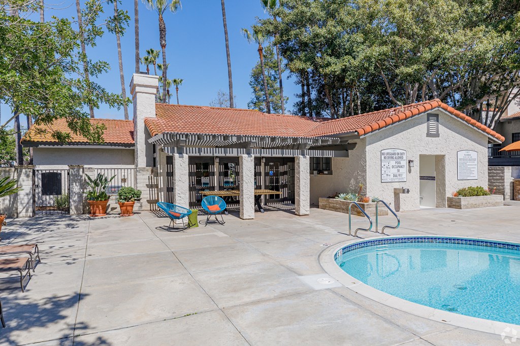 Clubhouse with a pool and patio at La Serena, California 92128