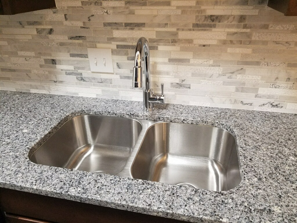 Under mount Sink, Goose Neck Faucet, Granite Top, and Back-splash