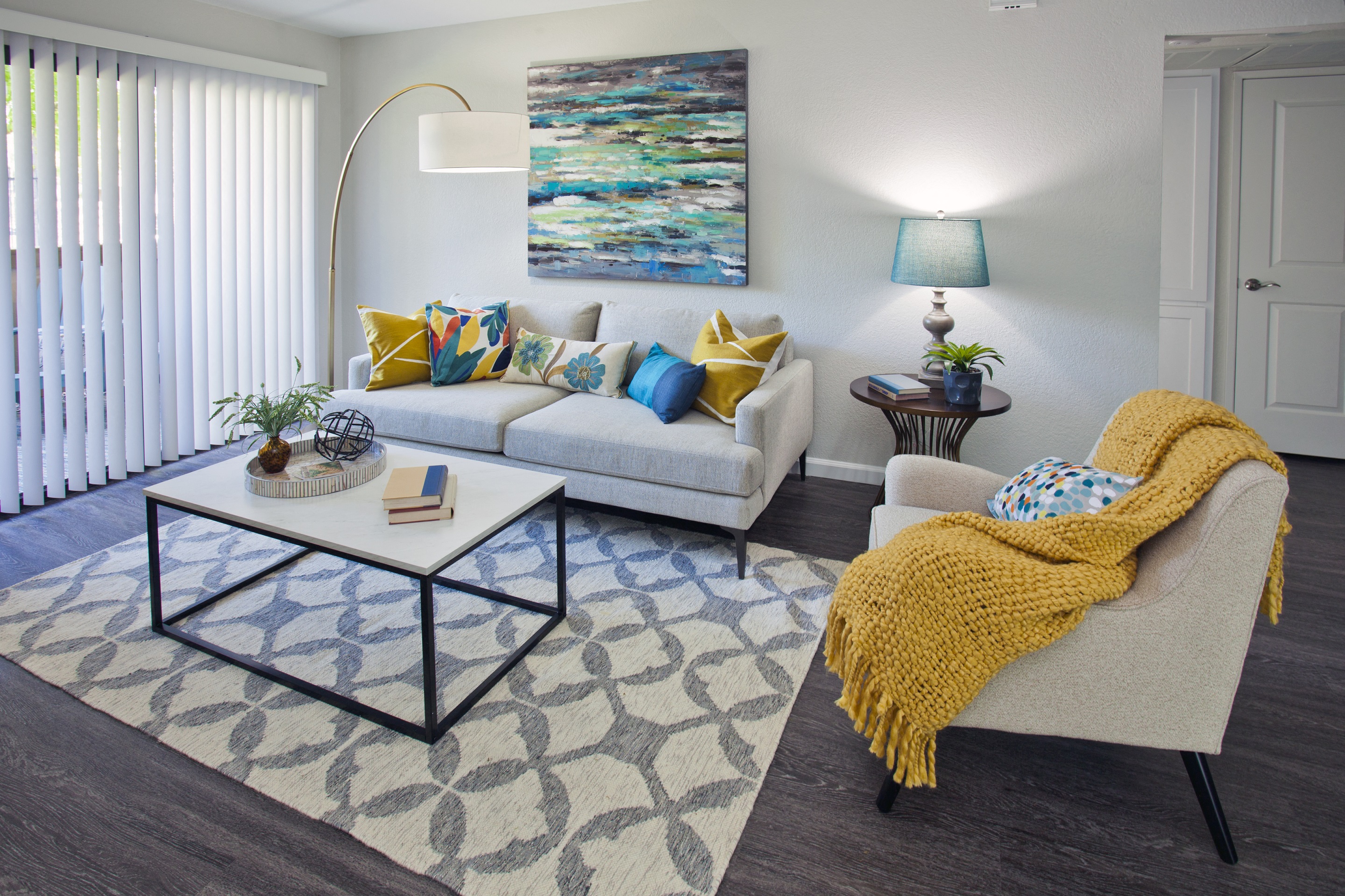 large living space with patio, fireplace, wood-like flooring for downstairs at Club Pacifica, California, 94510