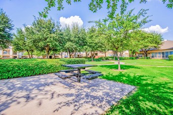 Huge courtyard with BBQ Grills at Tuscany Square Apartments in North Dallas, TX. Now leasing studios, 1 and 2 bedroom apartments. - Photo Gallery 4