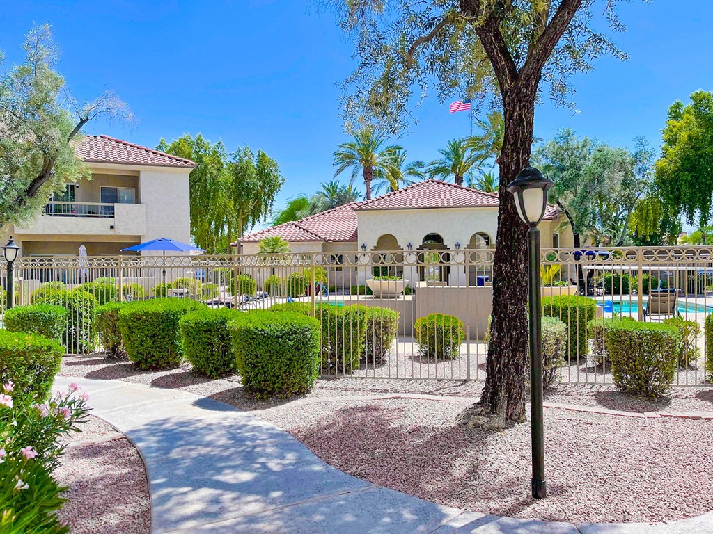 Courtyard view with trees and walkway at Ventana, Scottsdale, AZ
