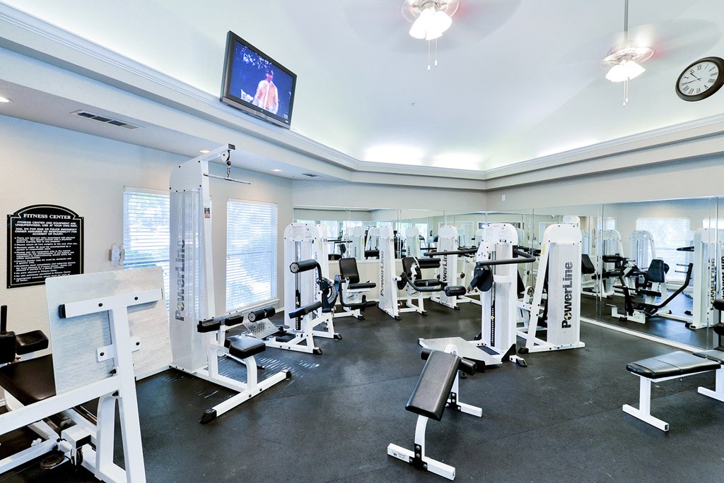Fitness center with cardio and weight training machines at Winsted at Valley Ranch, Irving