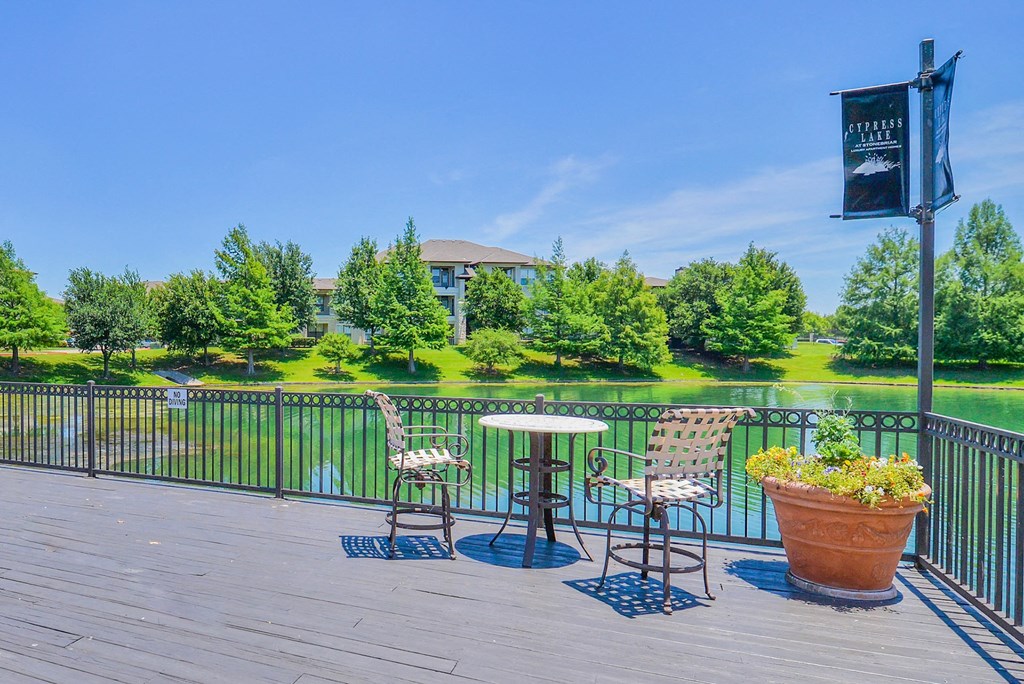 Lake doc with bistro tables and chairs at Cypress Lake at Stonebriar in Frisco, TX!