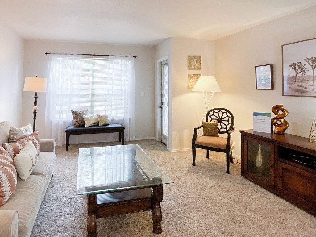 Interior living room with glass coffee table at Greenbriar Apartments, Oklahoma