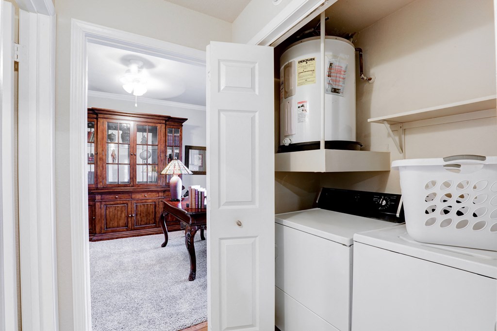 In-unit laundry view with shelf at SaddleBrook Apartments, Dallas, 75248