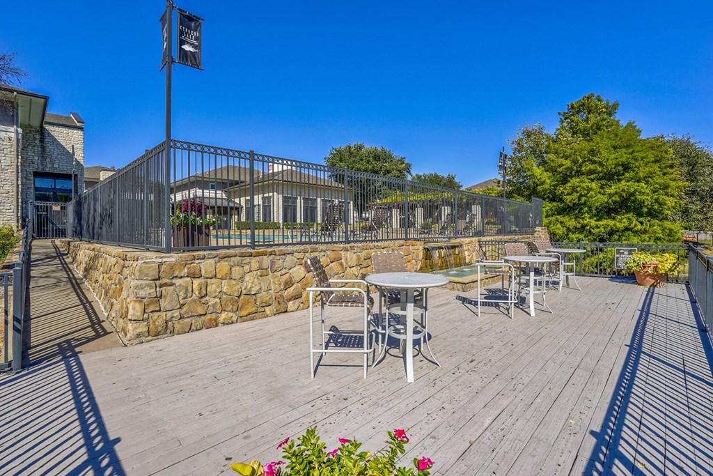 Lake doc with bistro tables for enjoyment at Cypress Lake at Stonebriar in Frisco, TX!
