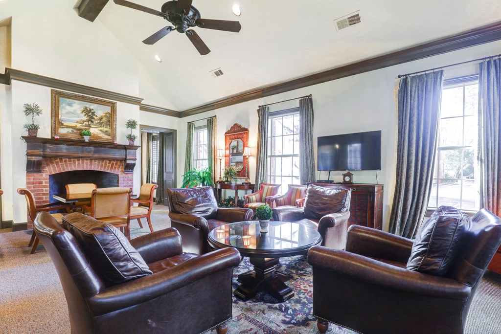 Community sitting area with fireplace at SaddleBrook Apartments, Dallas, TX