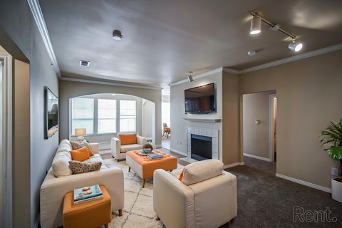 A living room with a fireplace and a couch.