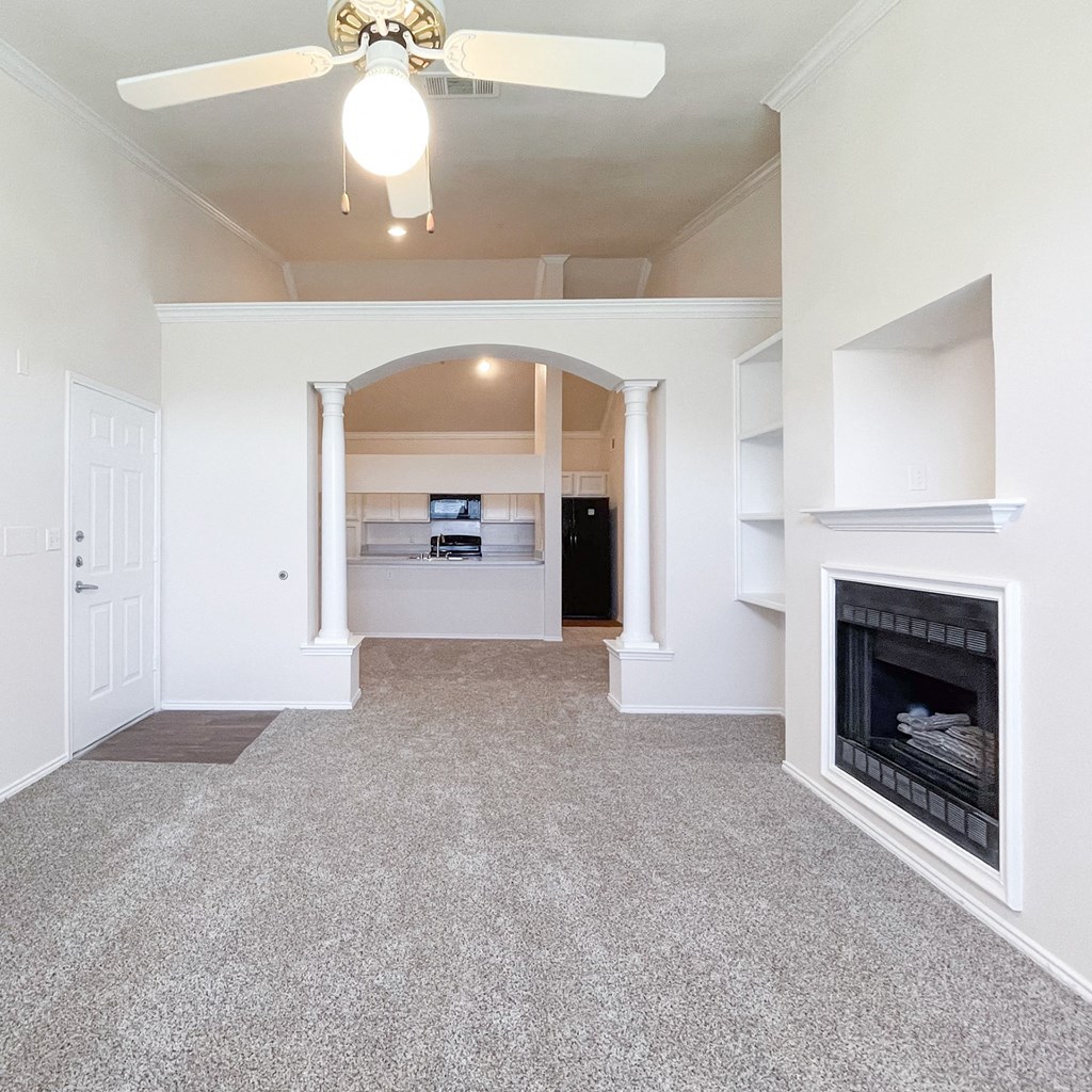 Spacious living area with fireplace at Turnberry Isle Apartment Homes, Dallas, TX, Texas