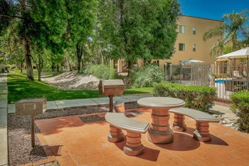 Courtyard surrounded by luscious large trees at Pavilions at Pantano in Tuscon, AZ! - Photo Gallery 6