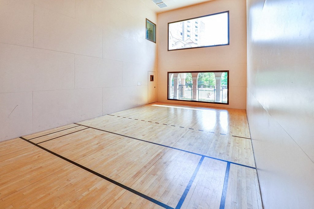 Indoor racquetball court with natural light at Villas at Katy Trail Apartments, Texas, 75201
