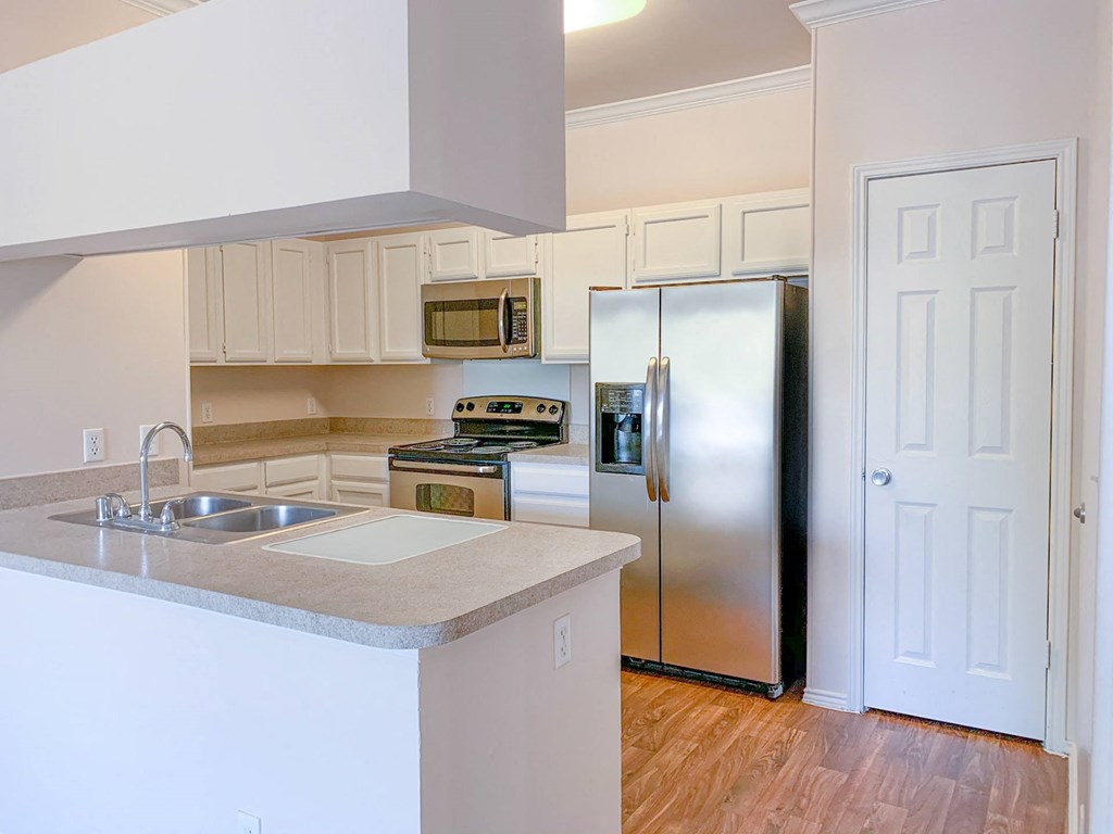 Kitchen view with stainless steel appliances at Turnberry Isle Apartment Homes, Texas, 75248