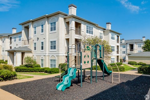 Playground with a green slide at Estancia Apartments, Tulsa, OK, Oklahoma , 74133