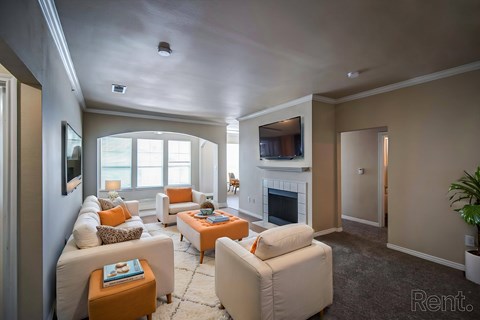 A living room with a fireplace and a couch.