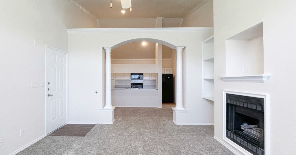 Living room with a fireplace at Turnberry Isle Apartment Homes, Texas, 75248
