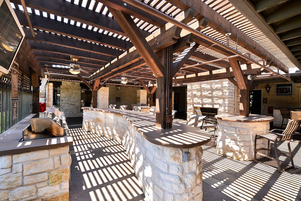Grilling area outside of the community pool area at Cypress Lake at Stonebriar in Frisco, TX!