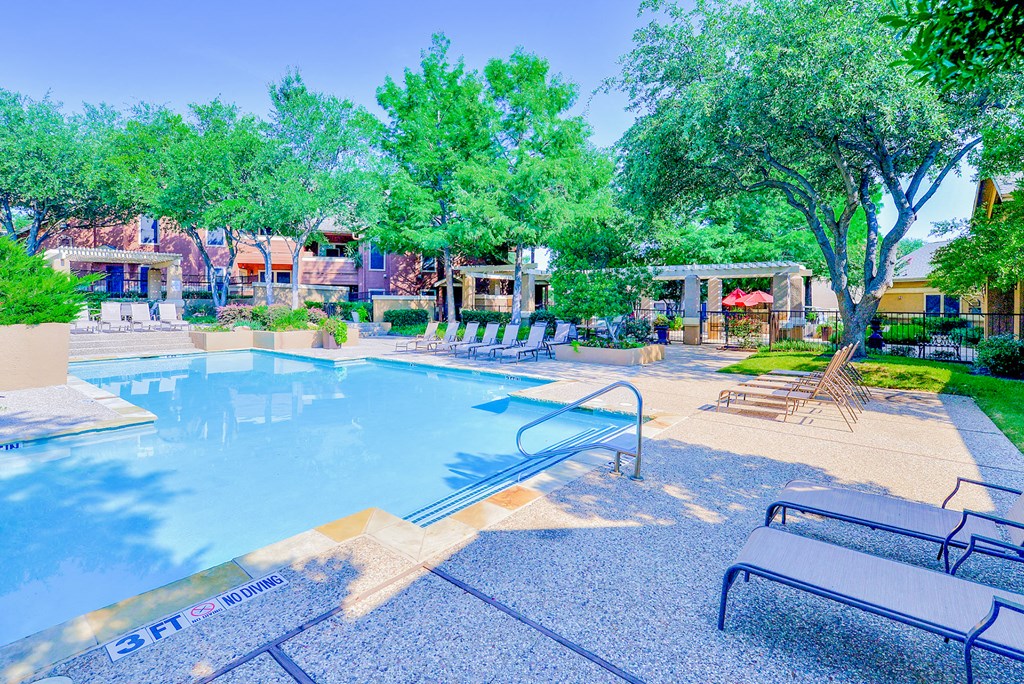 Pool with sundeck and lounge chairs at Winsted at Valley Ranch, Irving, 75063
