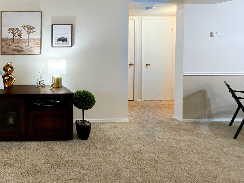 Interior living room with beige carpetingat Greenbriar Apartments, Tulsa