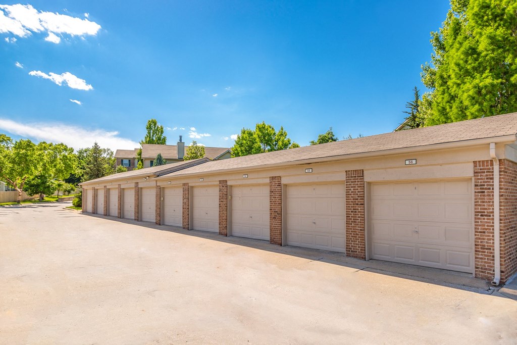 A row of garage doors are closed at Prairie Commons - 55+ Senior Community Apartments, Lawrence 66049
