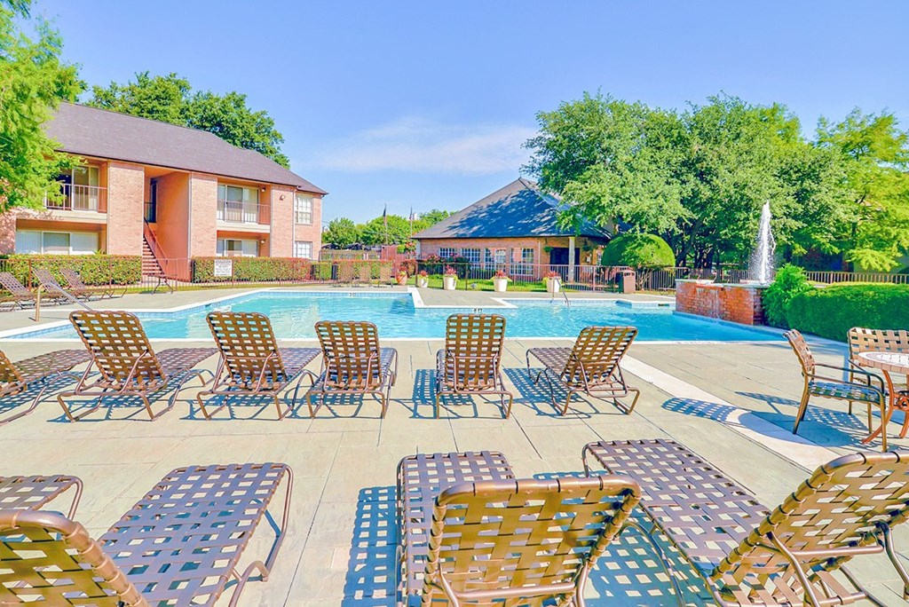 Resort-style pool surrounded by lounge chairs!