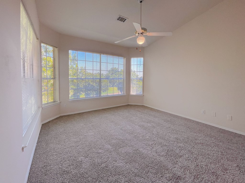 Spacious bedroom with wide windows at Turnberry Isle Apartment Homes, Dallas, TX, 75248
