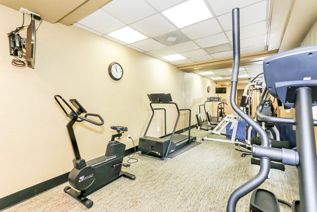 Fitness center with yellow walls at Country Club at The Meadows, Las Vegas, NV