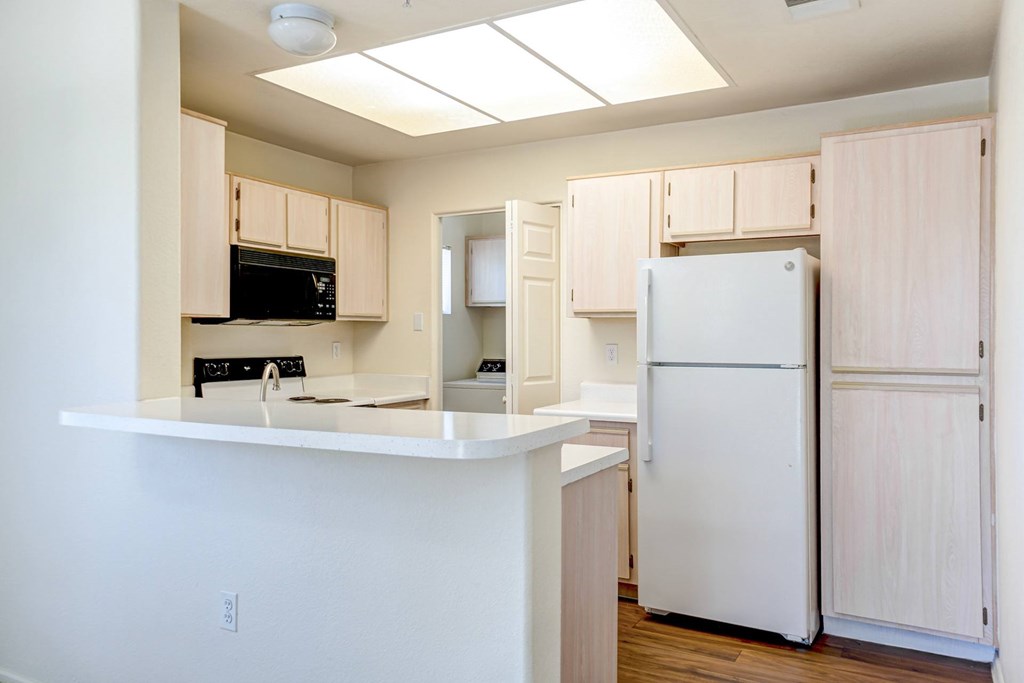 A kitchen with a white refrigerator and cabinets. at Ventana, Scottsdale, Arizona