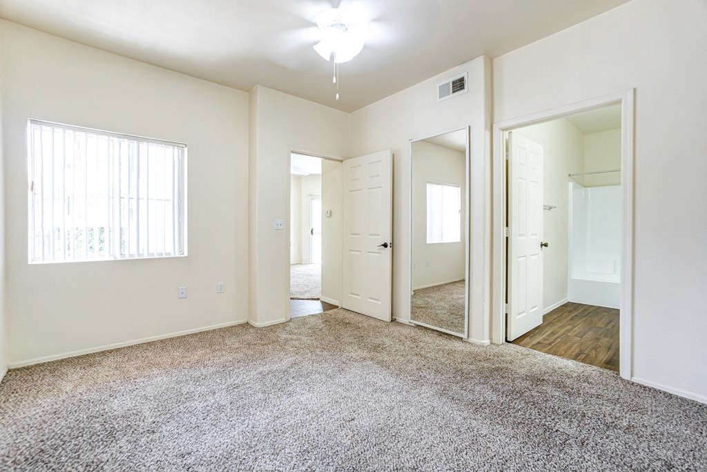 A spacious room with a carpeted floor and white walls. at Ventana, Scottsdale, Arizona