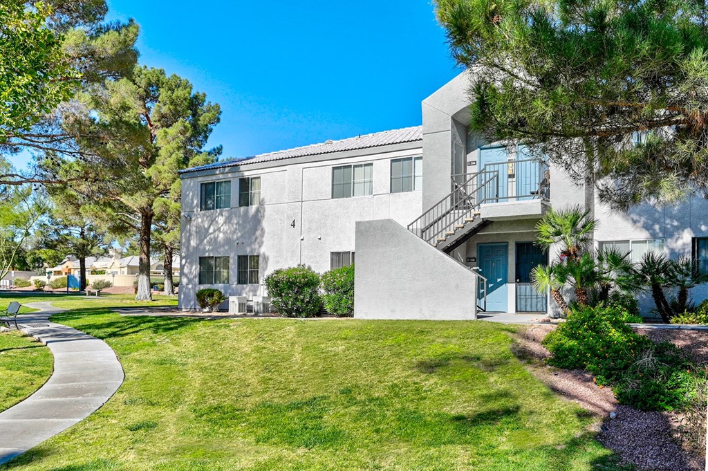  Exterior of apartment with trees and lush landscaping at Country Club at The Meadows, Las Vegas, Nevada