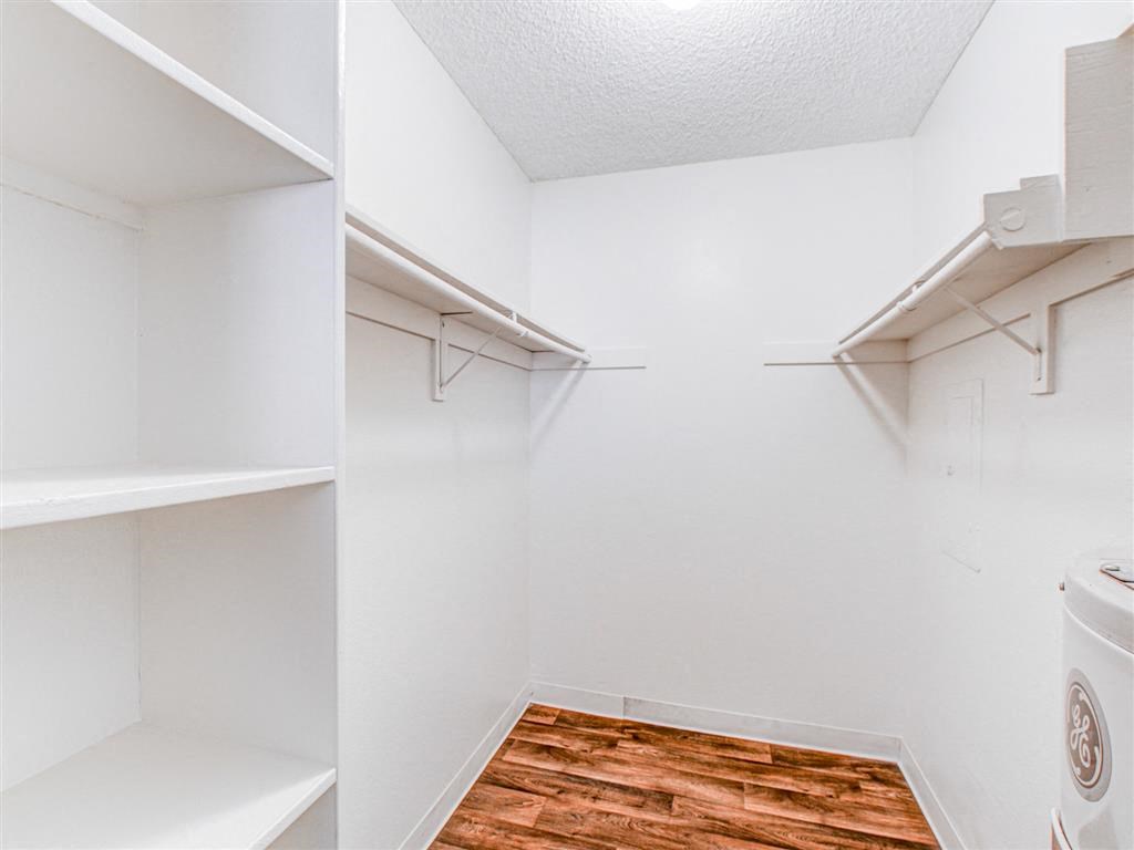 Walk-in style closet with wood flooring at Woodlake, California, 92027
