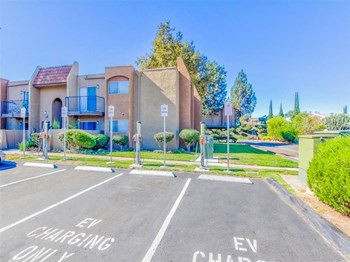 EV Charging parking at Woodlake Apartments in Escondido, CA, For Rent. Now leasing Studio, 1 and 2 bedroom apartments. - Photo Gallery 6
